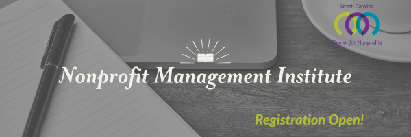 Close up of desk with lined notepad and pen, laptop keyboard, and white teacup. Text: Nonprofit Management Institute - Registration Open!