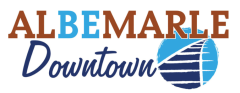 Albemarle Downtown logo. The letters "BE" are highlighted, giving the logo a second meaning of "Be Downtown". Blue traintracks in the shape of an A are shown.