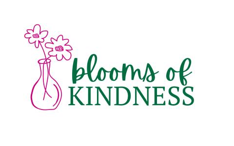 small pink flower vase with green text saying blooms of KINDNESS to the side