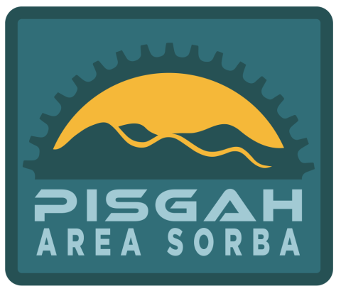 Pisgah Area SORBA text with sun rising over the blue ridge mountains and a chain ring arc