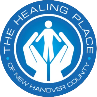 The Healing Place of New Hanover County with the image of hands holding a person 