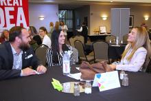 Several nonprofit professionals enjoying a conversation around a table during a Center event.